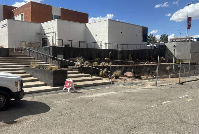 Building with fenced landscaping area.