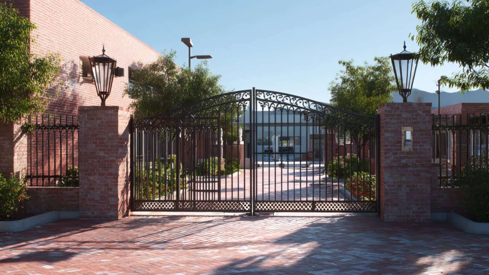 Elegant gated entrance with brick walls